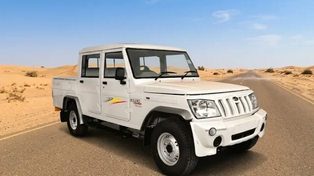 Indian Bolero Camper driving through muddy Indian village roads