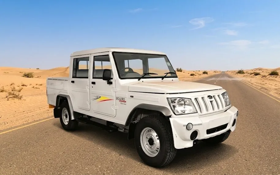 Indian Bolero Camper driving through muddy Indian village roads